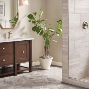 Bathroom with grey tile floor and transitional dark wood vanity